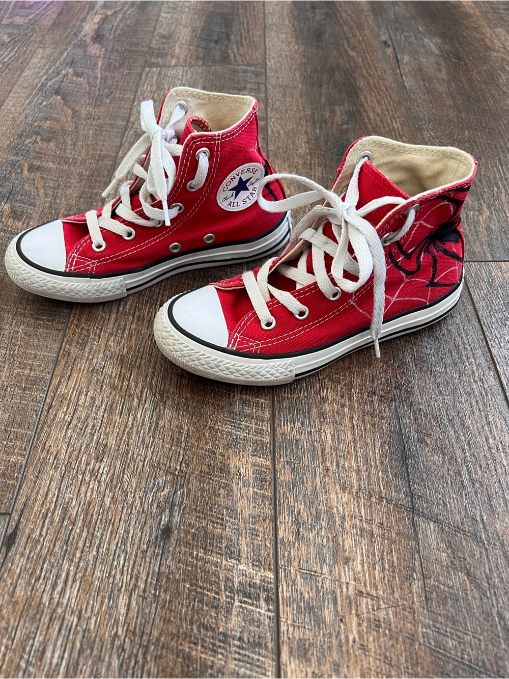 Converse Red High Top Sneakers with White Soles and Spider Web Accent